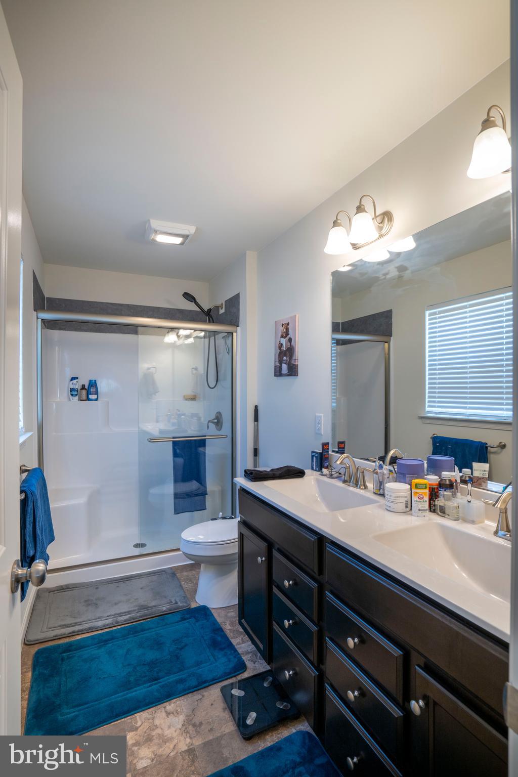 273 Fawn Valley Road State College, PA 16803 - Photo 25 of 47 a bathroom with a sink double vanity granite and a mirror