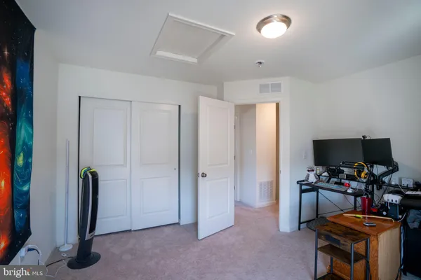 a room with furniture and a flat screen tv