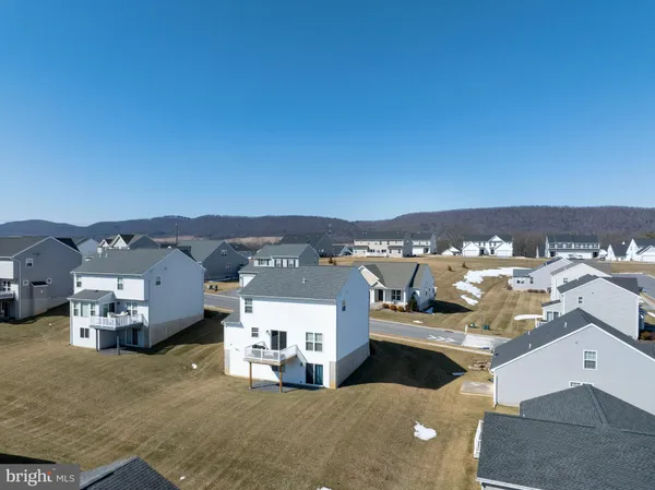 an aerial view of a house with a ocean view
