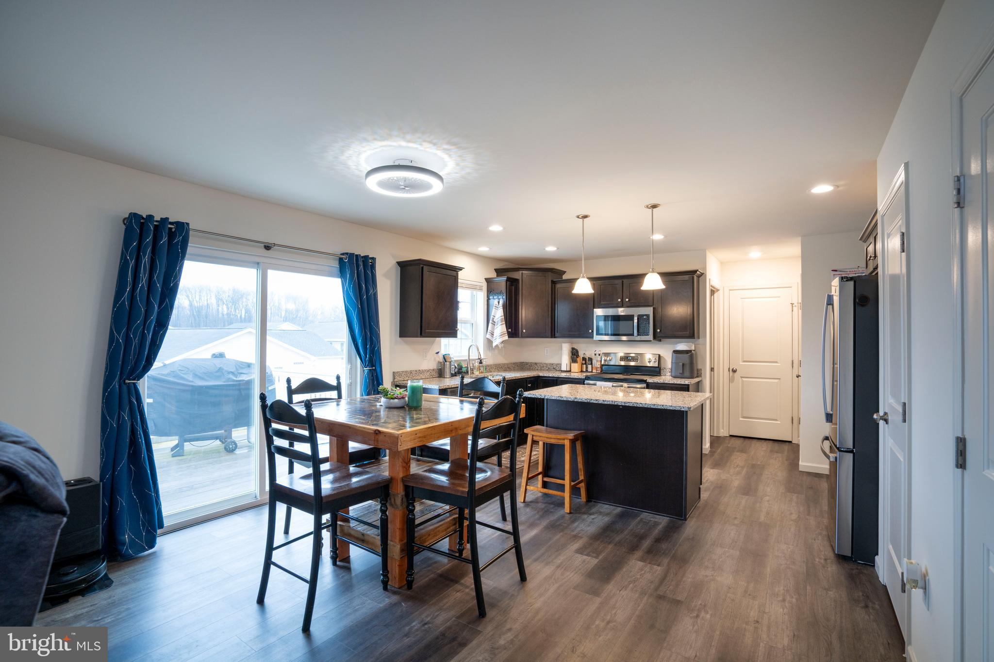 273 Fawn Valley Road State College, PA 16803 - Photo 10 of 47 a view of a dining room with furniture window and wooden floor