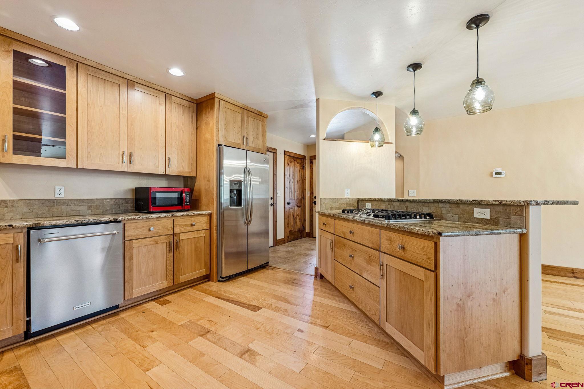 157 Window Lake Trail Durango, CO 81301 - Photo 11 of 39 a kitchen with stainless steel appliances granite countertop a stove a sink and a refrigerator
