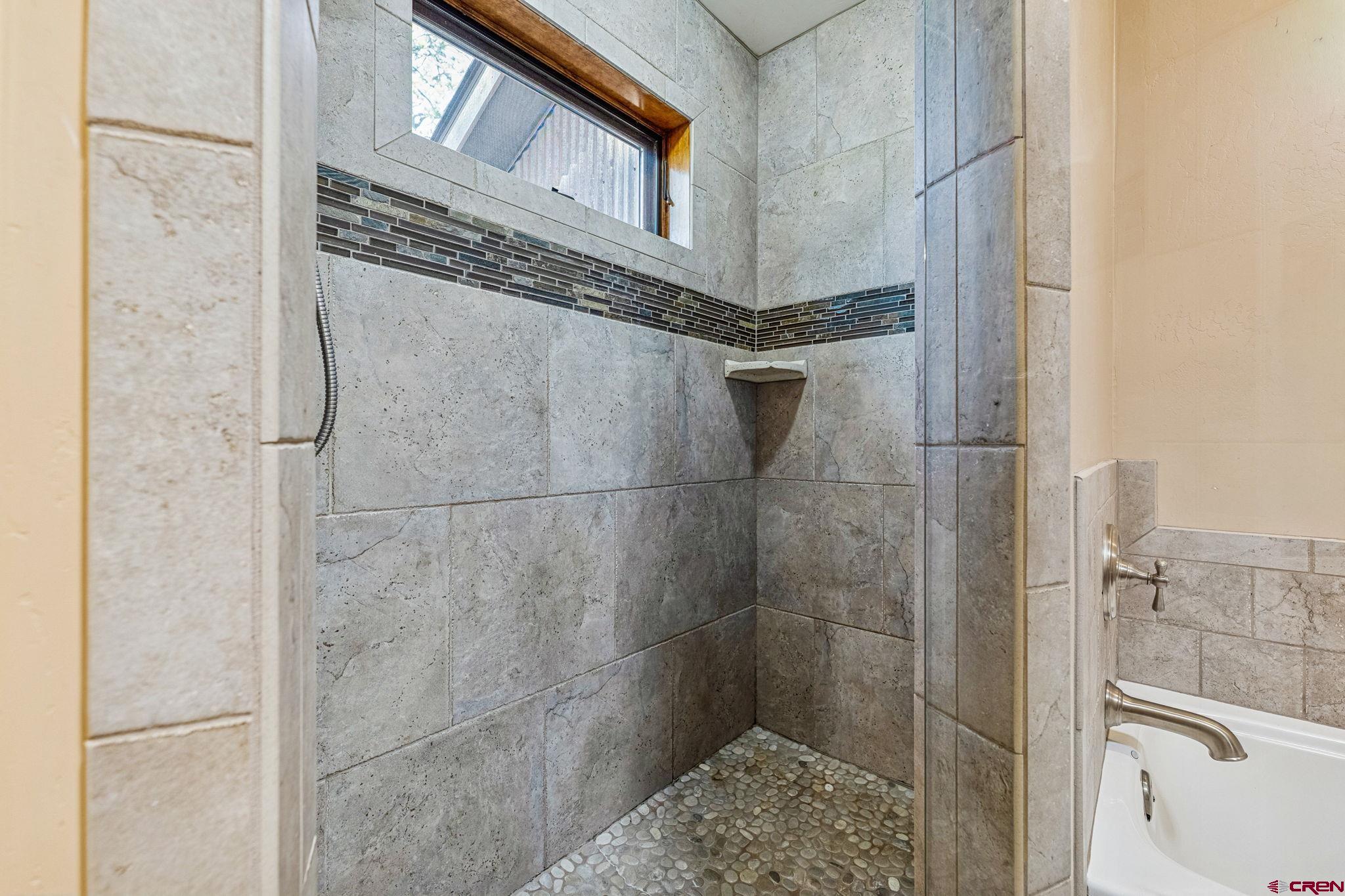 157 Window Lake Trail Durango, CO 81301 - Photo 19 of 39 a bathroom with a bathtub