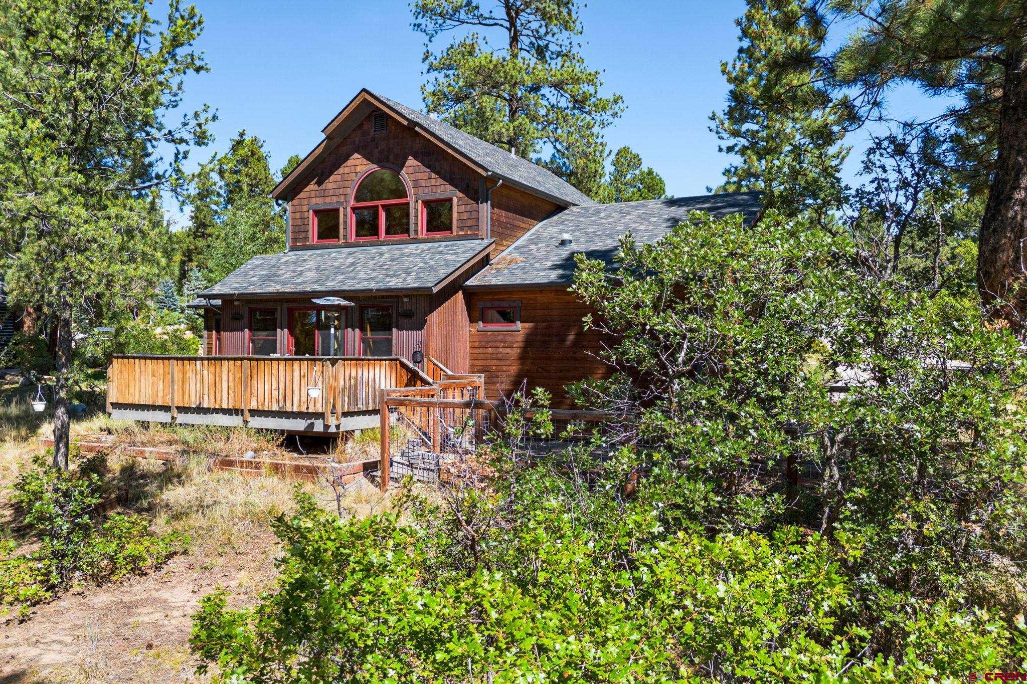 157 Window Lake Trail Durango, CO 81301 - Photo 33 of 39 a view of a big house with wooden fence and garden