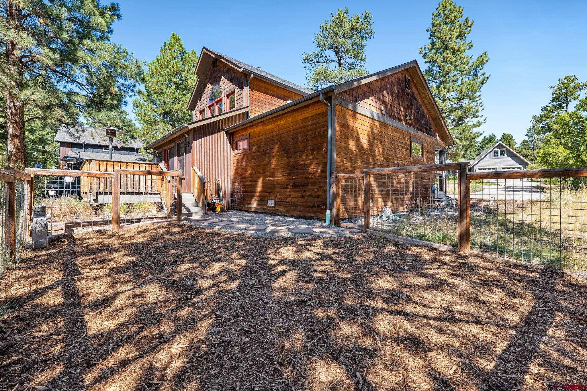 157 Window Lake Trail Durango, CO 81301 - Photo 35 of 39 a view of backyard with wooden fence and large trees