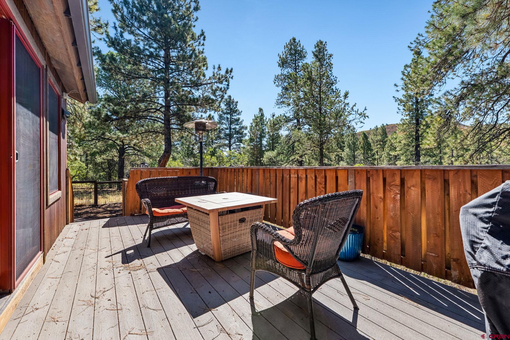 157 Window Lake Trail Durango, CO 81301 - Photo 36 of 39 a outdoor sitting area with furniture and wooden floor