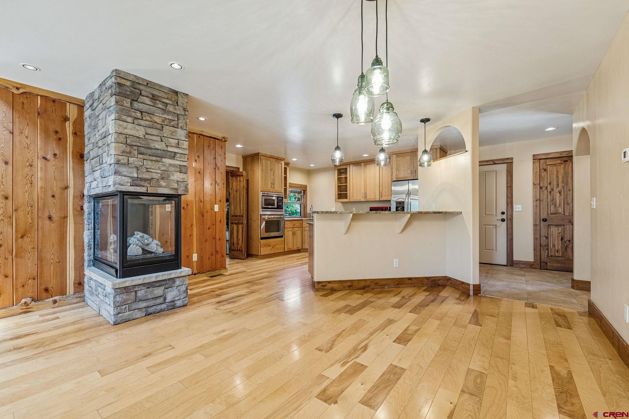 157 Window Lake Trail Durango, CO 81301 - Photo 9 of 39 a view of a kitchen with furniture and a fireplace