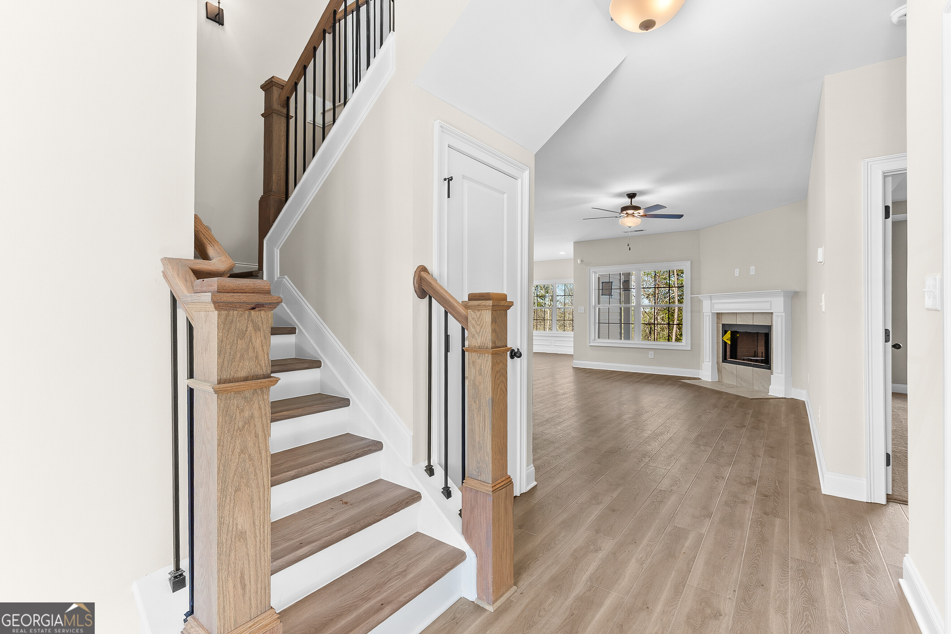 310 Air View Drive Warner Robins, GA 31093 - Photo 11 of 66 a view of a livingroom with wooden floor and stairs