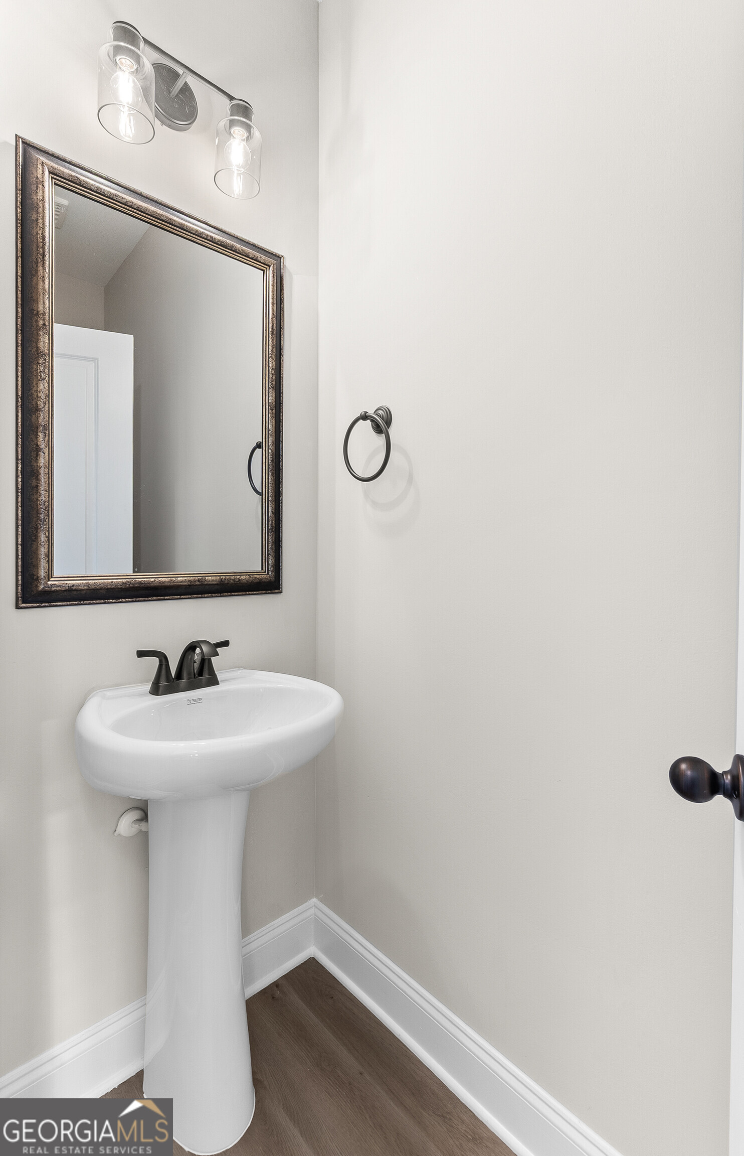 310 Air View Drive Warner Robins, GA 31093 - Photo 12 of 66 a bathroom with a sink and a mirror