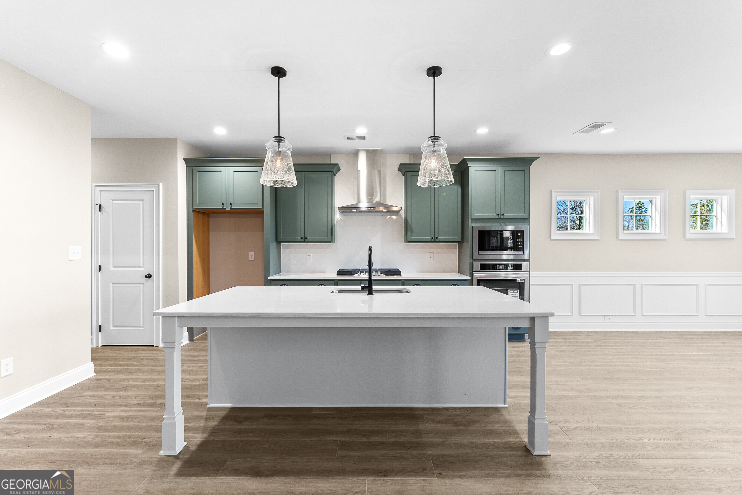 310 Air View Drive Warner Robins, GA 31093 - Photo 19 of 66 a view of a kitchen with kitchen island a sink stainless steel appliances and cabinets