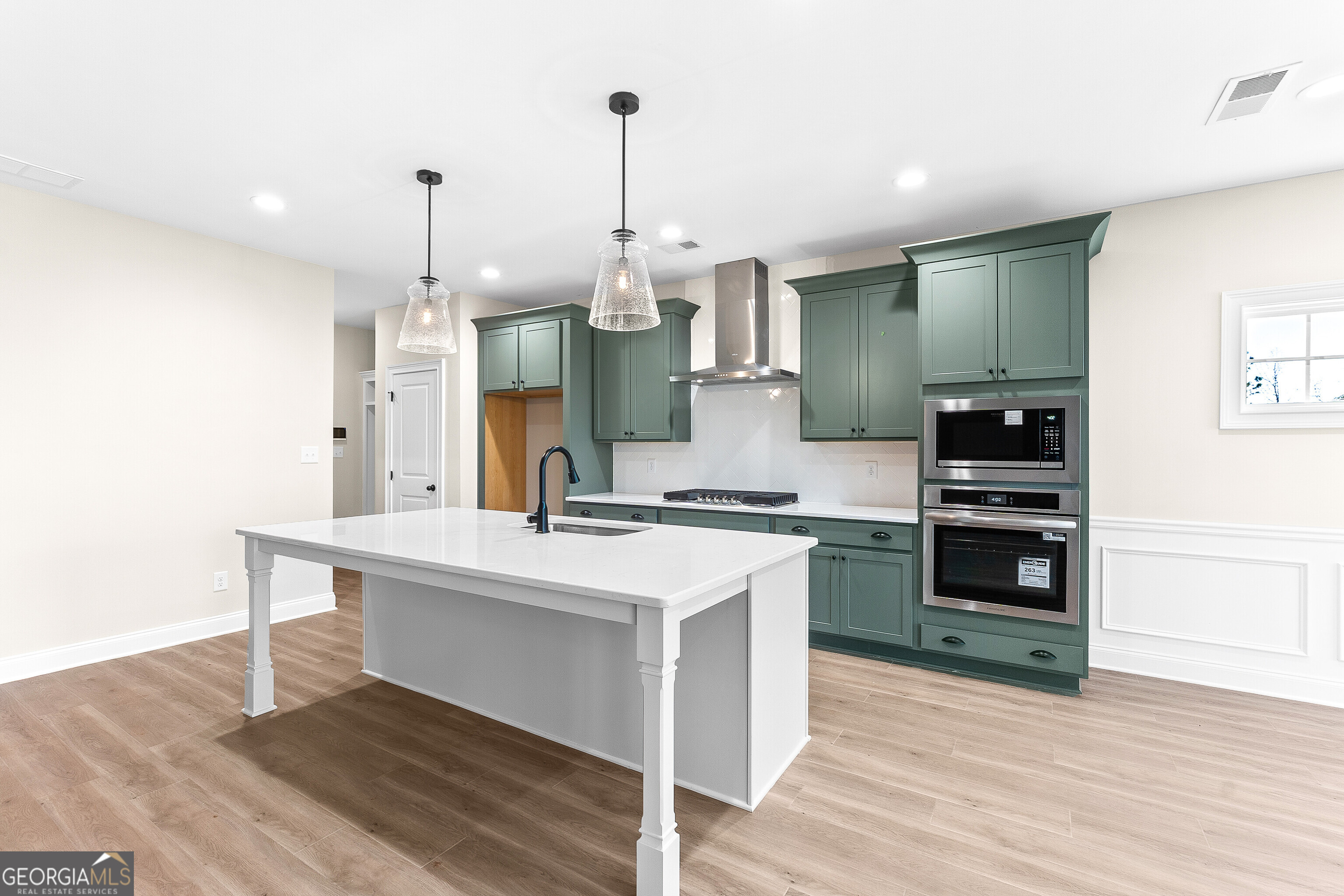 310 Air View Drive Warner Robins, GA 31093 - Photo 20 of 66 a kitchen with a sink a stove and a wooden floors