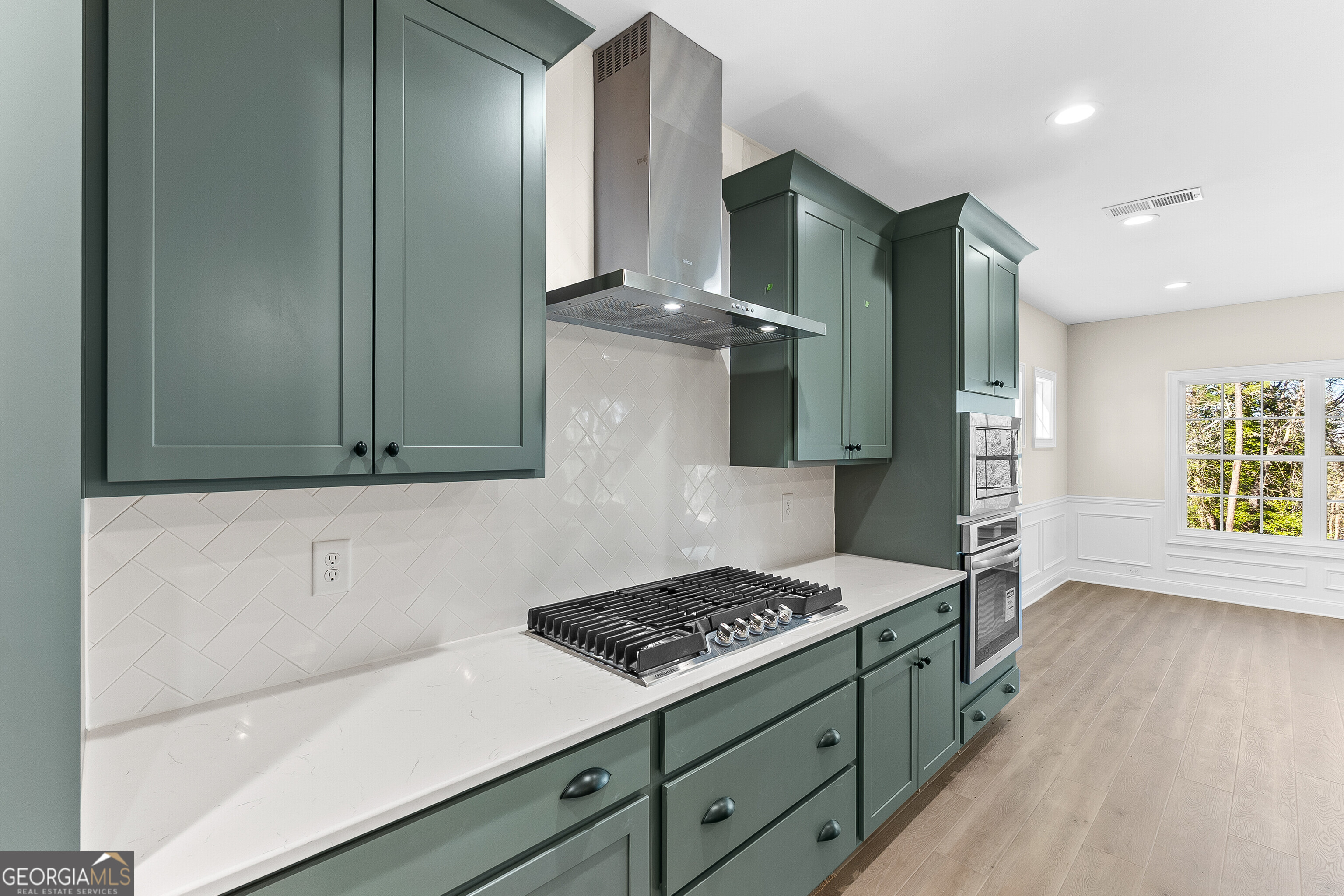 310 Air View Drive Warner Robins, GA 31093 - Photo 25 of 66 a kitchen with a sink a stove and cabinets