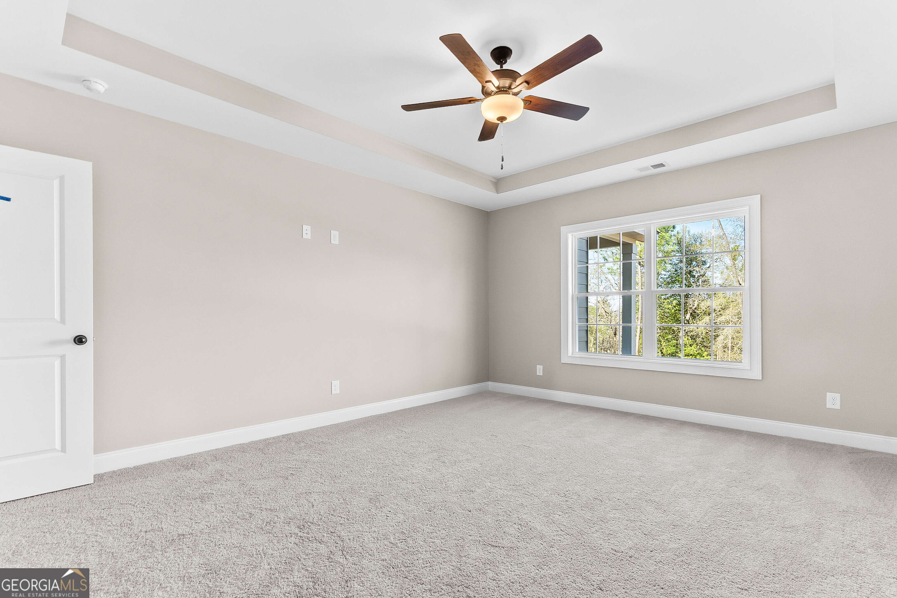 310 Air View Drive Warner Robins, GA 31093 - Photo 35 of 66 an empty room with windows and ceiling fan