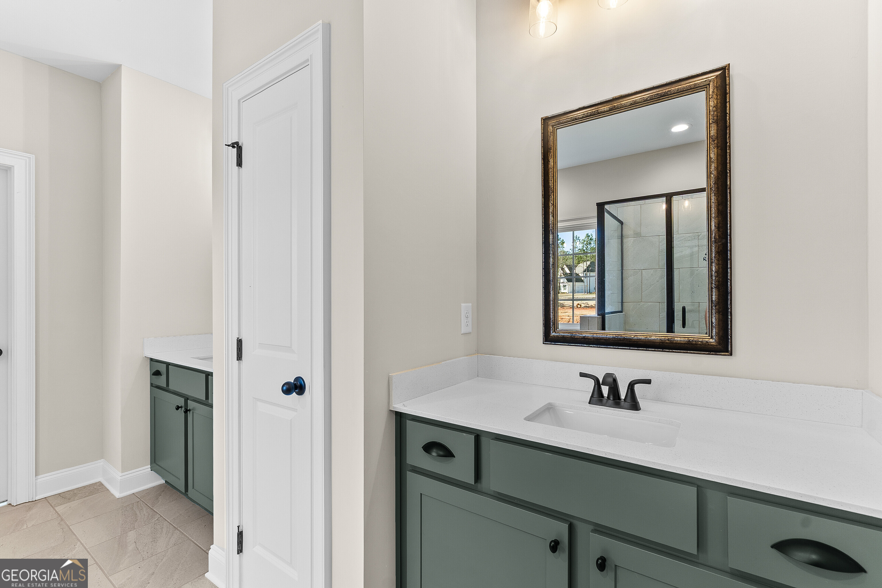 310 Air View Drive Warner Robins, GA 31093 - Photo 37 of 66 a bathroom with a sink and two mirror