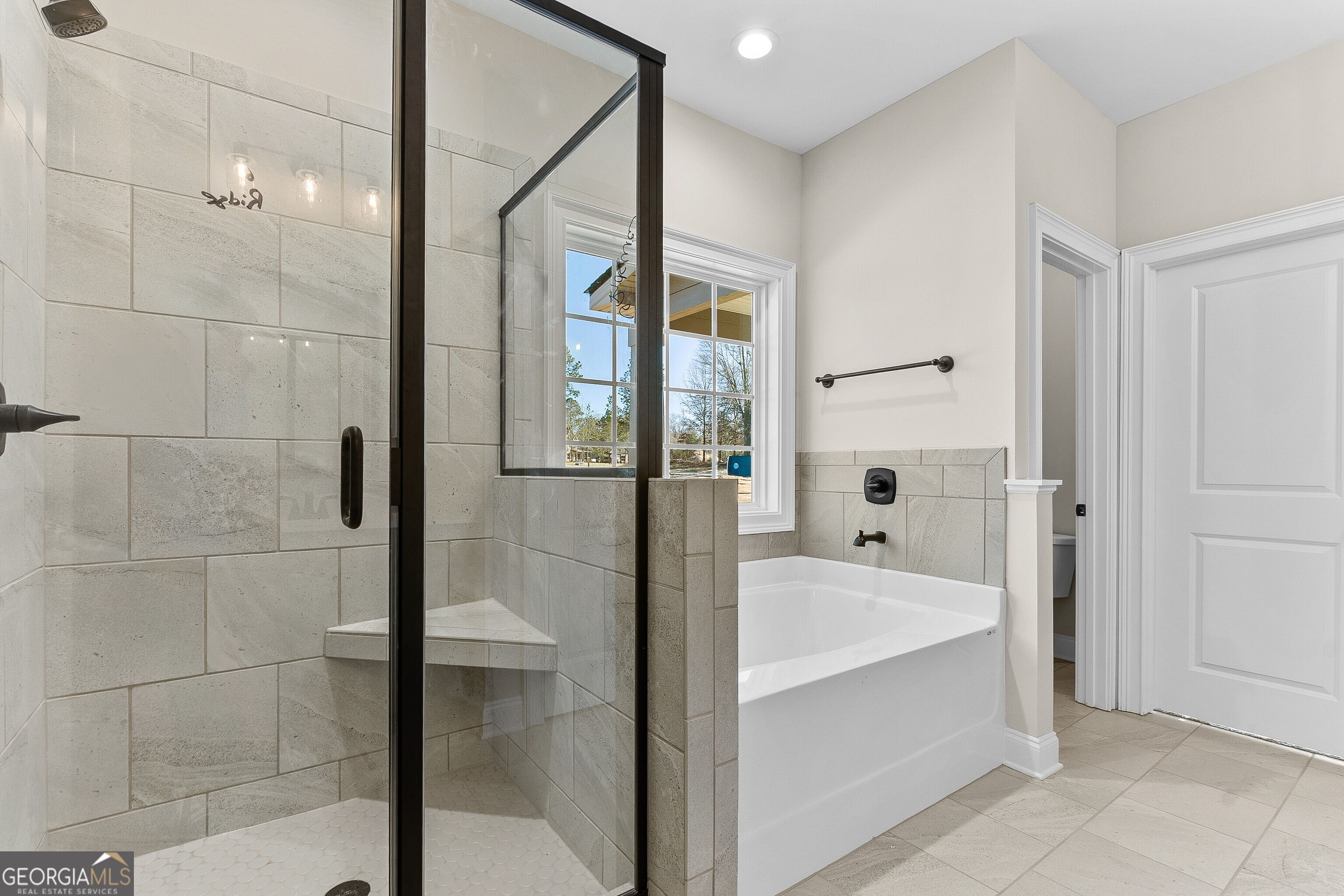 310 Air View Drive Warner Robins, GA 31093 - Photo 39 of 66 a bathroom with a bathtub and a shower