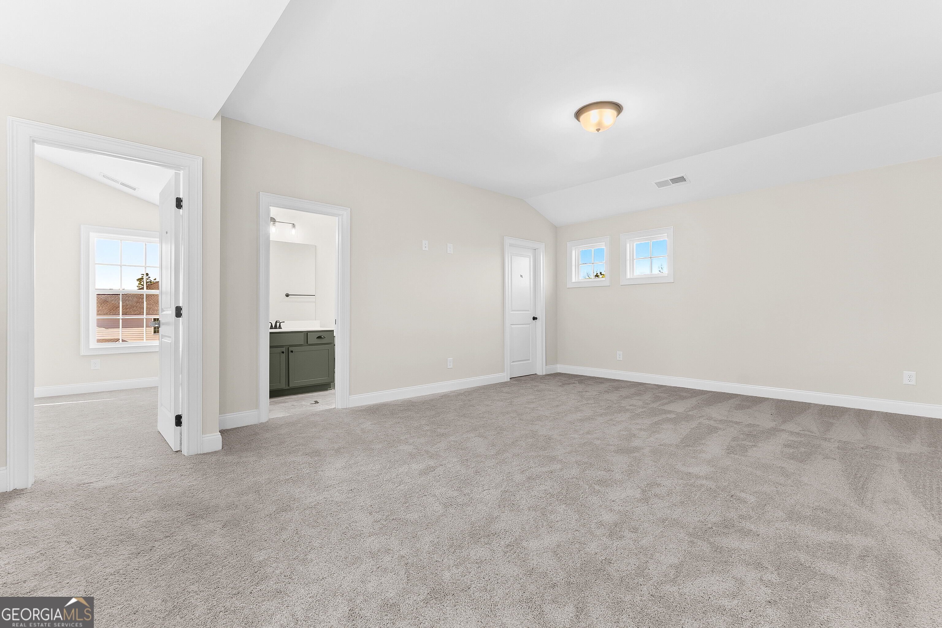 310 Air View Drive Warner Robins, GA 31093 - Photo 45 of 66 an empty room with windows and entrance to other room