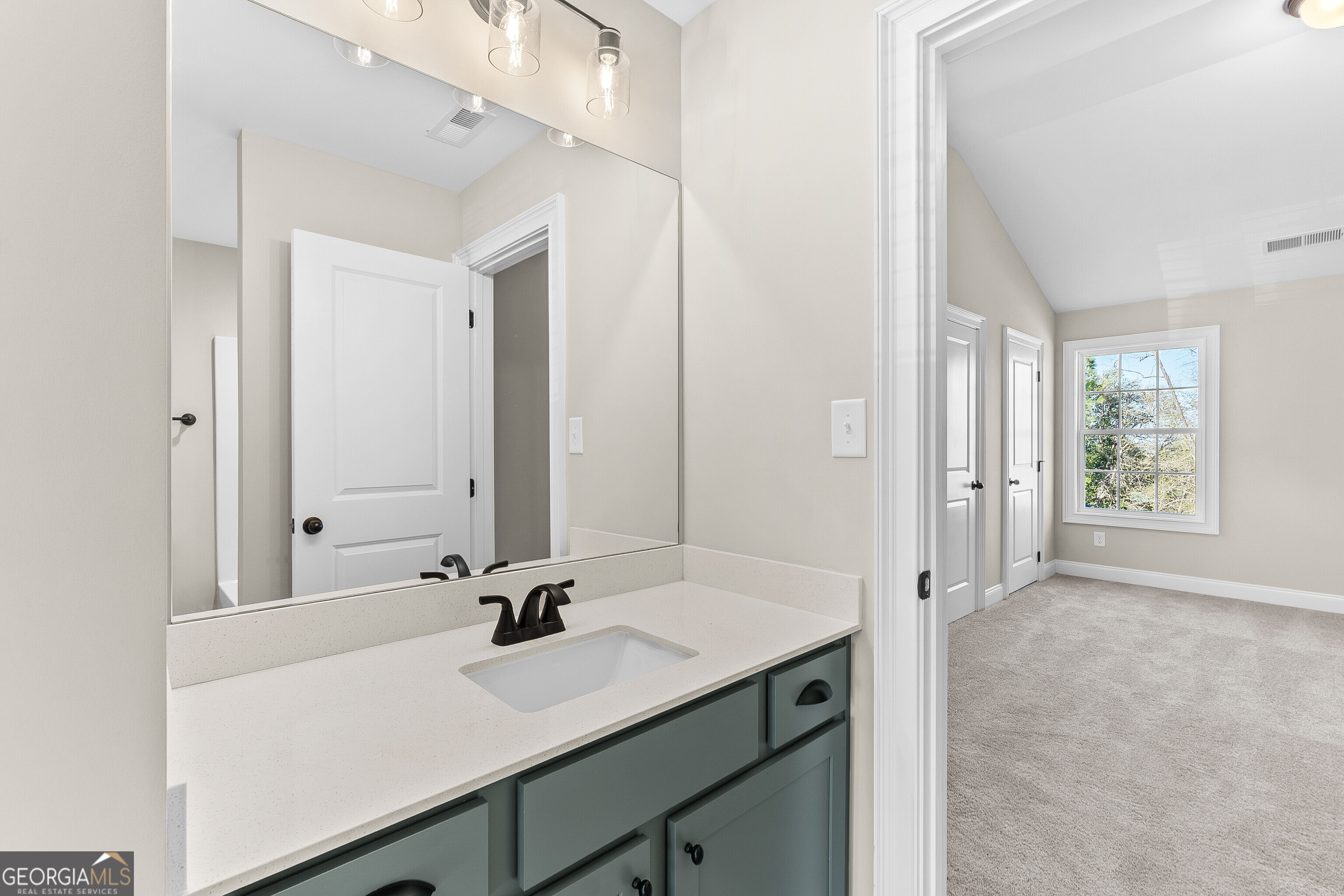 310 Air View Drive Warner Robins, GA 31093 - Photo 52 of 66 a view of bathroom with a sink mirror and