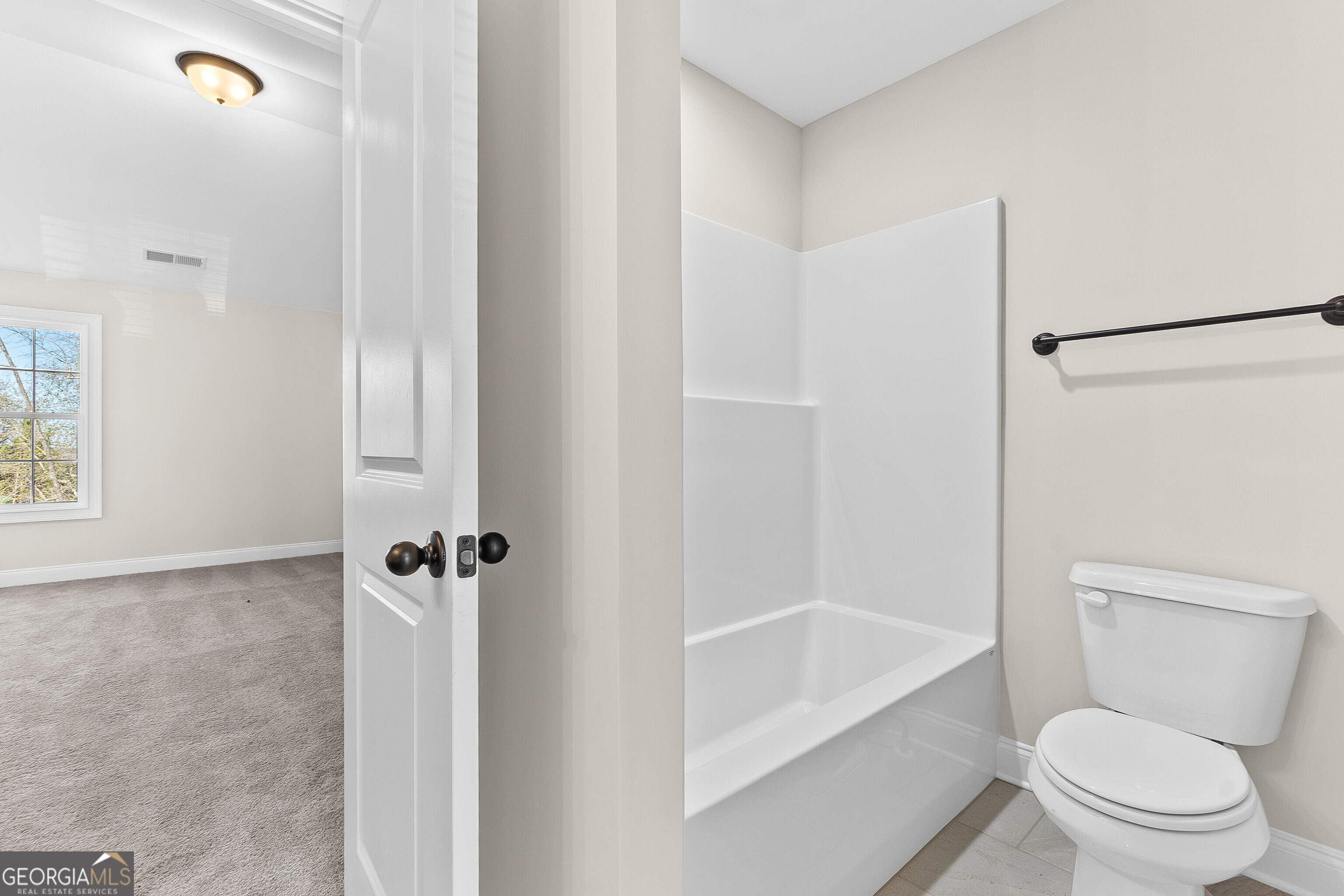 310 Air View Drive Warner Robins, GA 31093 - Photo 53 of 66 a white toilet sitting next to a bath tub