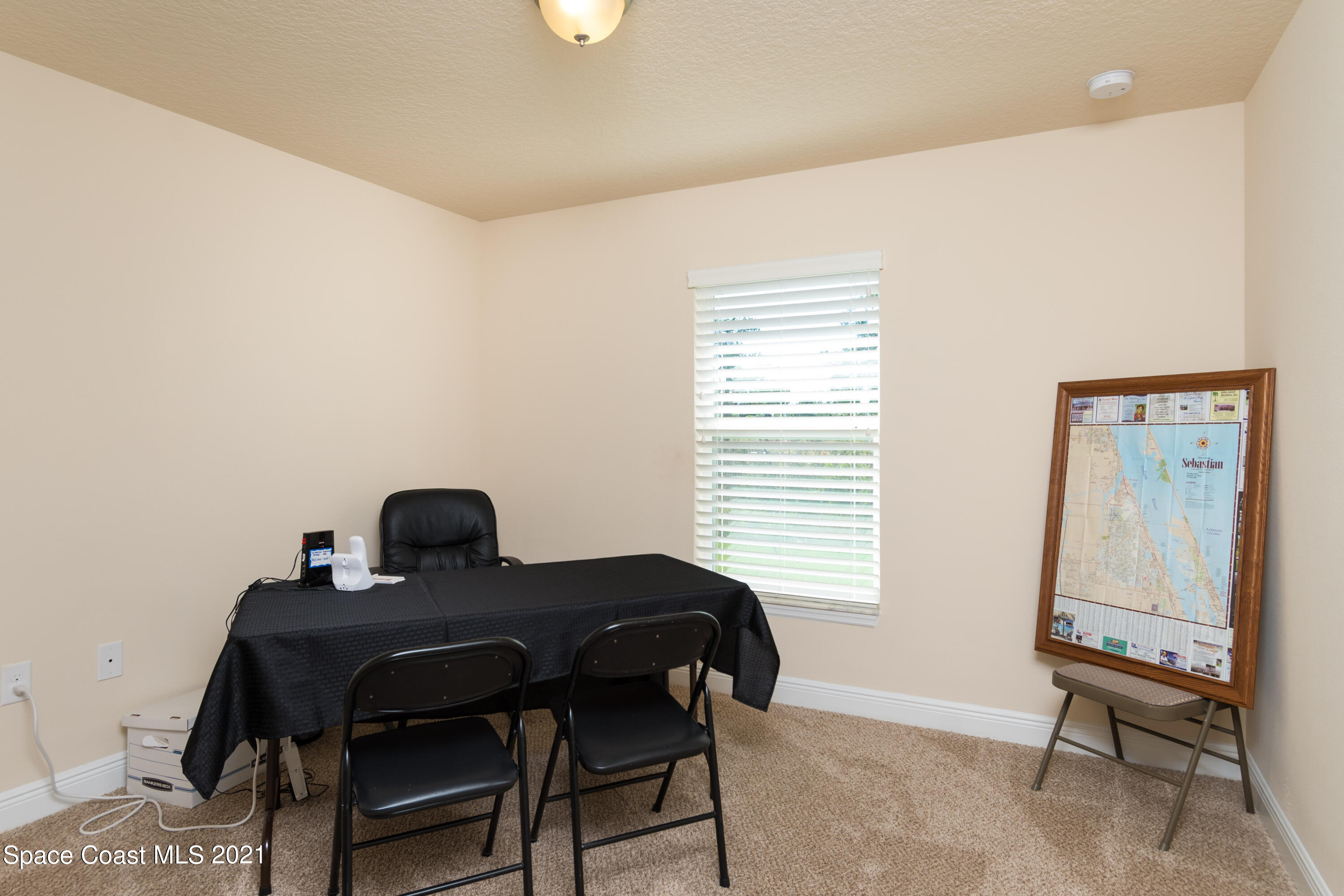 350 Garvey Road Palm Bay, FL 32908 - Photo 10 of 13 a bedroom with a bed and a window