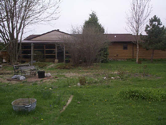 9110 East Weber Road Ridott, IL 61067 - Photo 2 of 12 a view of a house with backyard