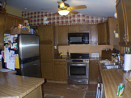 9110 East Weber Road Ridott, IL 61067 - Photo 4 of 12 a kitchen with a sink stainless steel appliances and cabinets