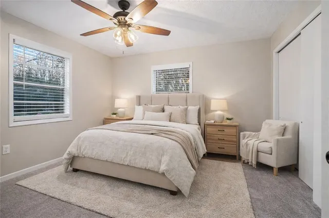 a bedroom with bed and window