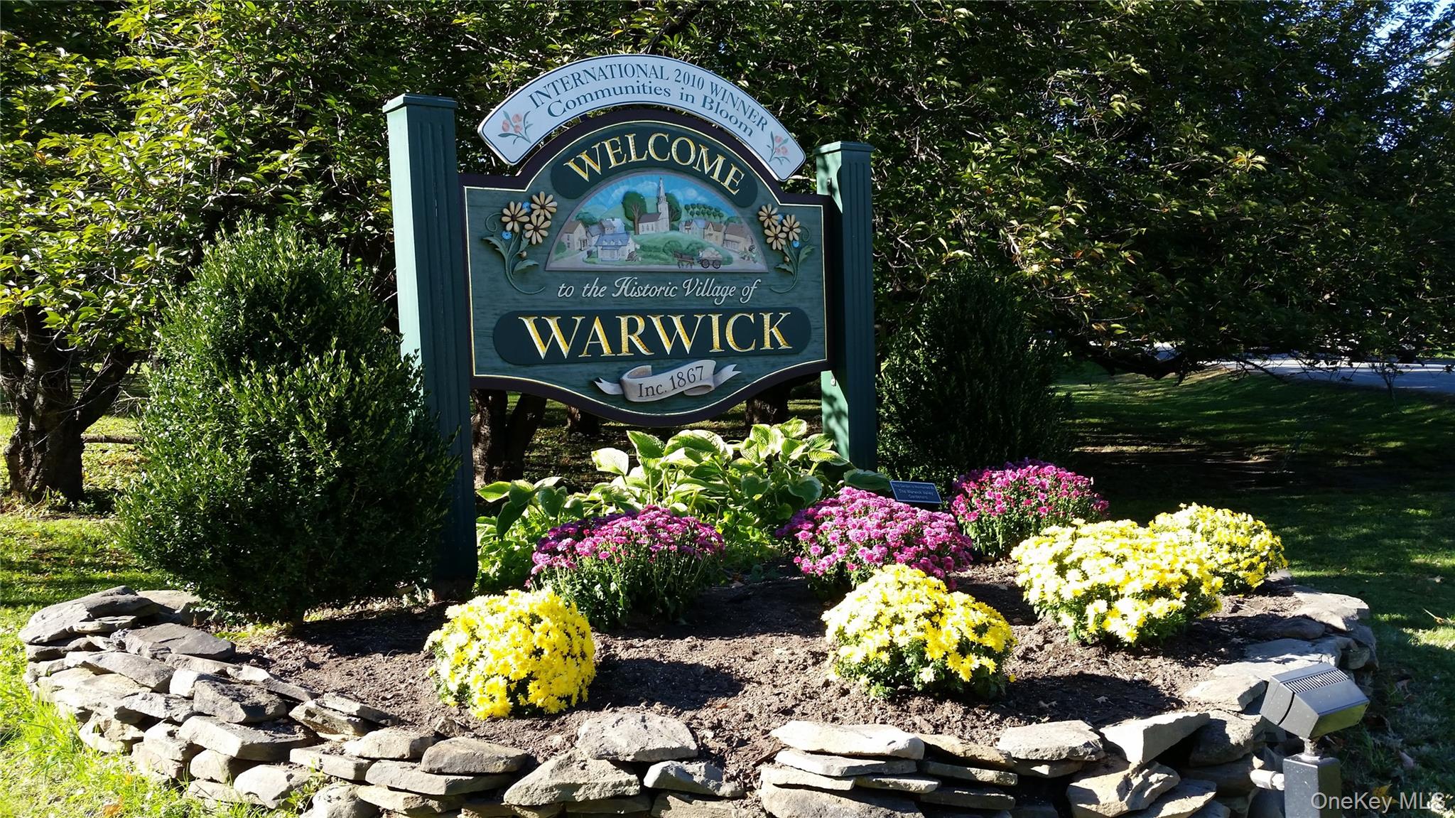 43 The Rise Warwick, NY 10990 - Photo 42 of 49 a sign that is in front of flowers