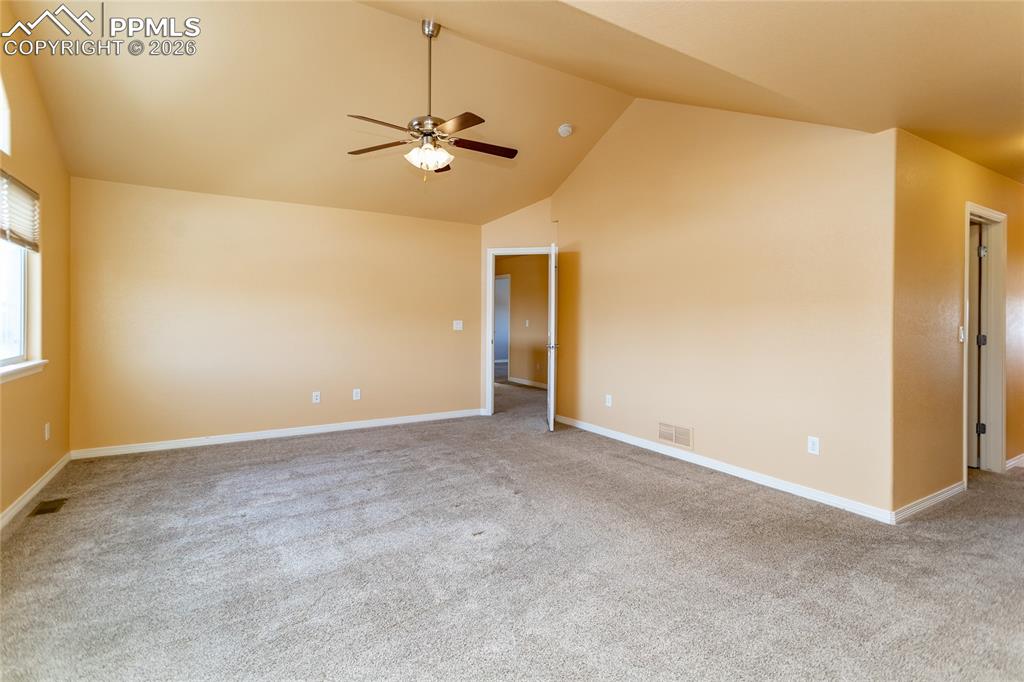 7160 Red Cardinal Loop Colorado Springs, CO 80908 - Photo 13 of 49 a view of an empty room with a chandelier fan