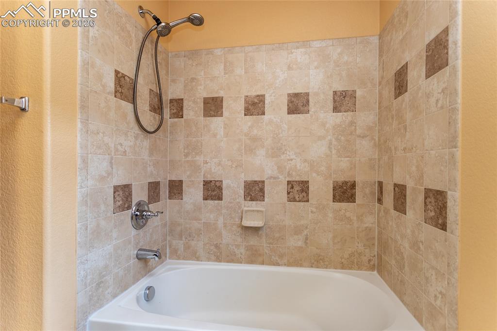 7160 Red Cardinal Loop Colorado Springs, CO 80908 - Photo 22 of 49 a bathroom with a shower