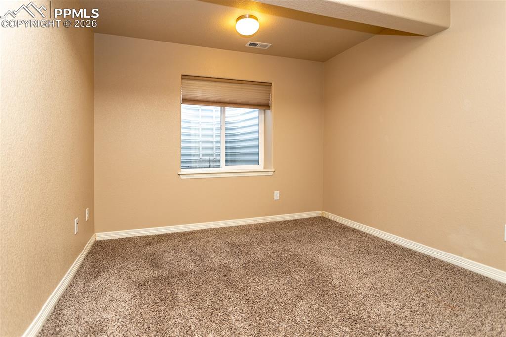 7160 Red Cardinal Loop Colorado Springs, CO 80908 - Photo 35 of 49 an empty room with a window