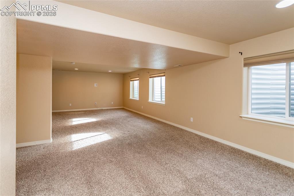 7160 Red Cardinal Loop Colorado Springs, CO 80908 - Photo 38 of 49 a view of an empty room with a window