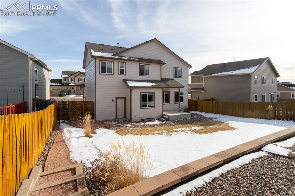 7160 Red Cardinal Loop Colorado Springs, CO 80908 - Photo 40 of 49 a view of a house with snow