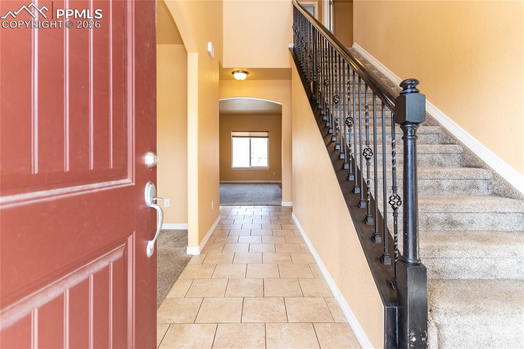 7160 Red Cardinal Loop Colorado Springs, CO 80908 - Photo 4 of 49 a view of a stairs and an entryway