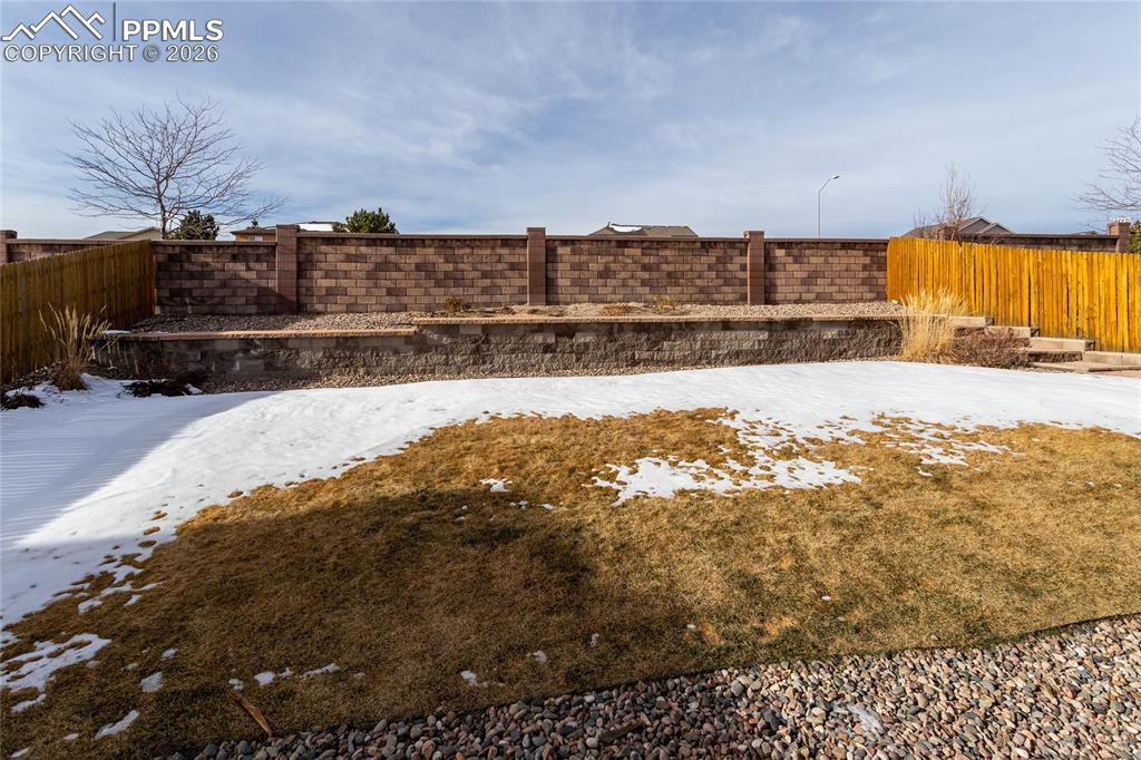 7160 Red Cardinal Loop Colorado Springs, CO 80908 - Photo 43 of 49 a view of swimming pool of water with wooden fence