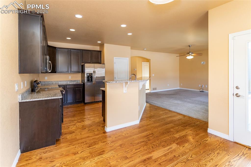 7160 Red Cardinal Loop Colorado Springs, CO 80908 - Photo 5 of 49 a view of kitchen with wooden floor