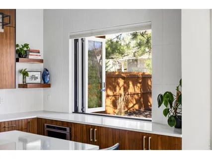 a kitchen with a sink and a large window