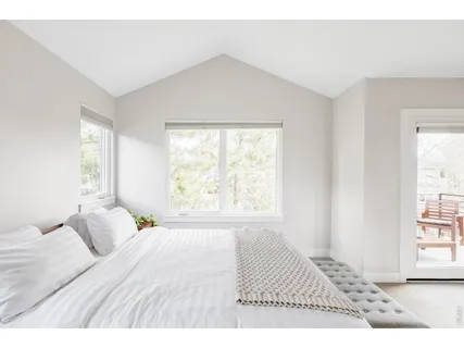 a bathroom with a granite countertop double vanity sink mirror and double