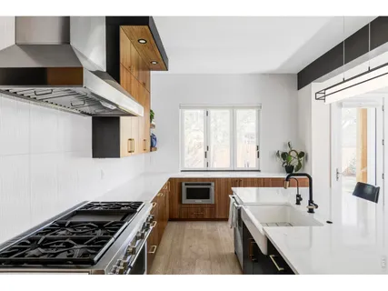 a kitchen with a stove and a sink