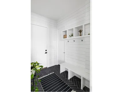 a front view of a house with yard and seating space