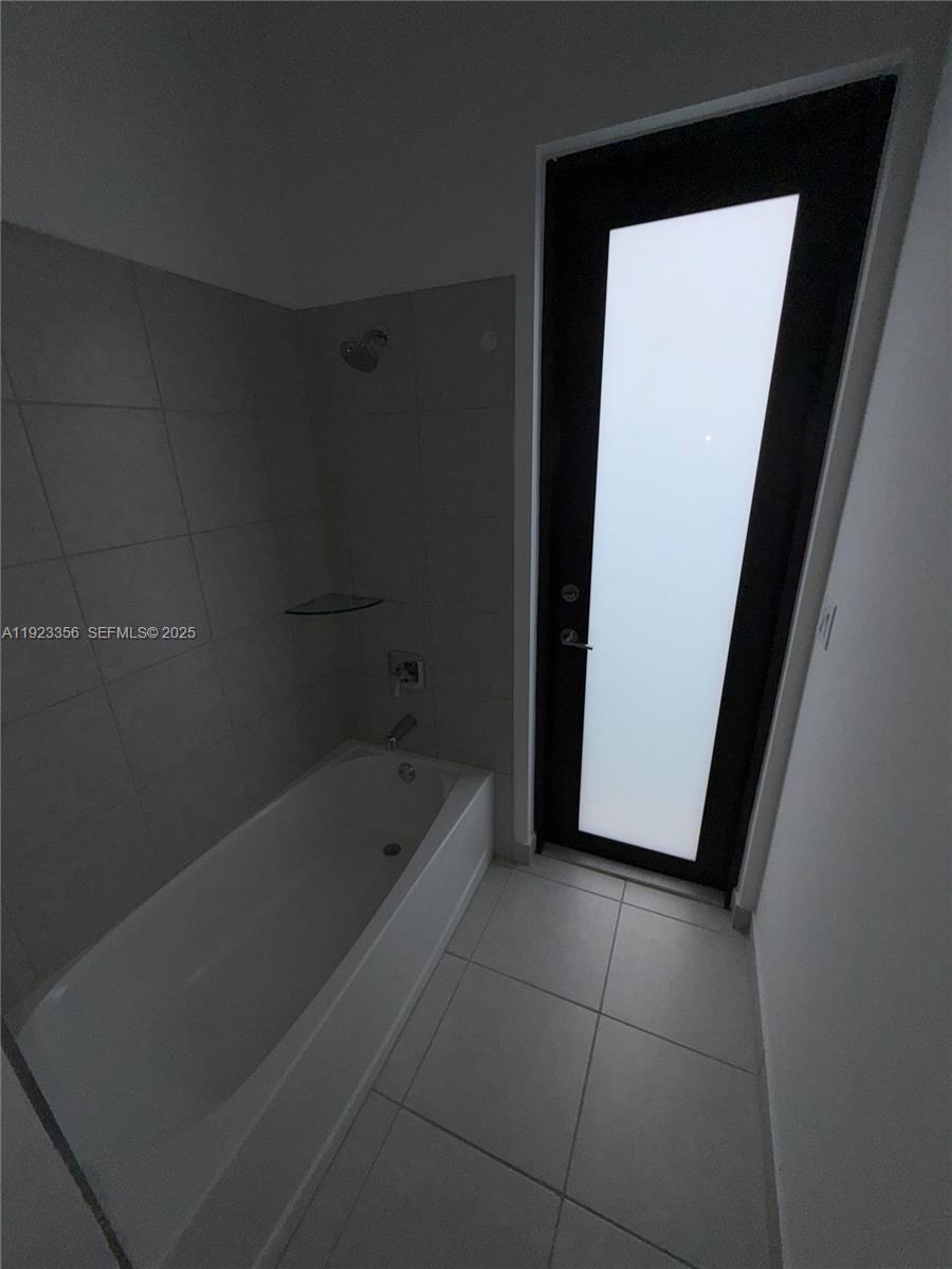 4321 Southwest 173rd Avenue Miramar, FL 33029 - Photo 12 of 28 a bathroom with a bathtub