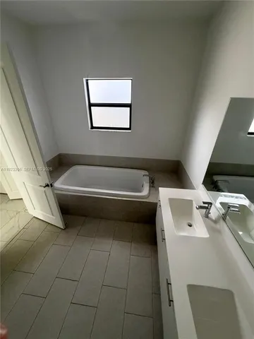 a bathroom with a sink toilet and bathtub