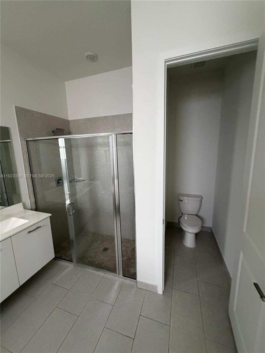 4321 Southwest 173rd Avenue Miramar, FL 33029 - Photo 17 of 28 a bathroom with a sink a toilet and a shower