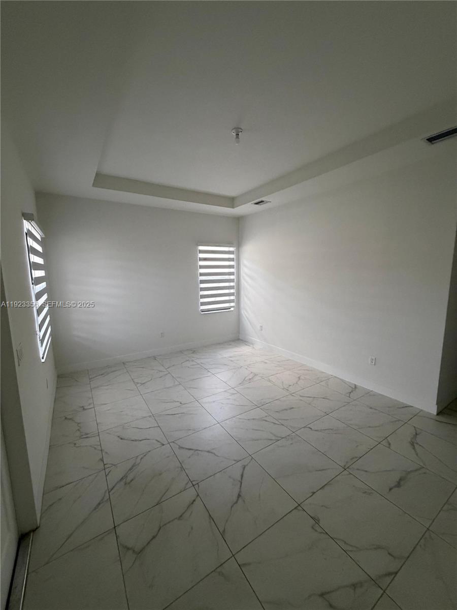 4321 Southwest 173rd Avenue Miramar, FL 33029 - Photo 22 of 28 a view of an empty room with a window