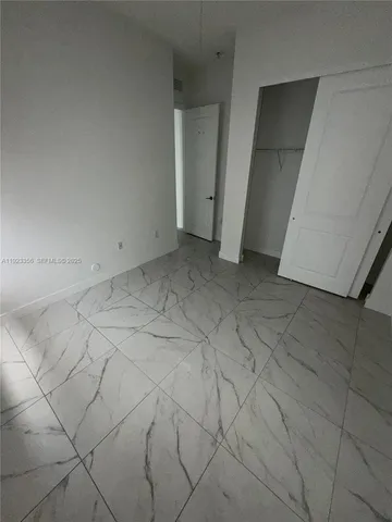 a view of a room with white walls