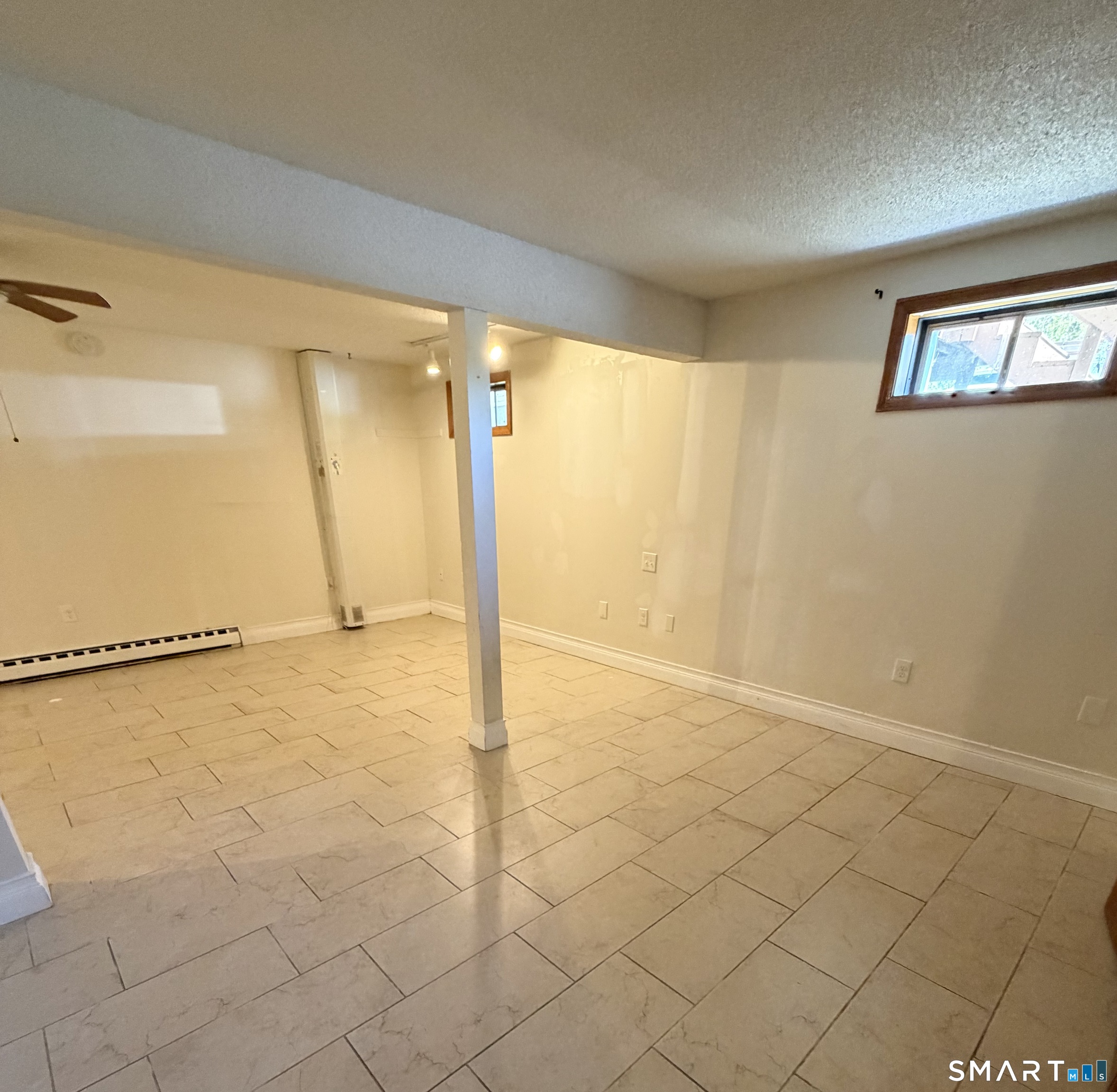 33 River Street Windsor, CT 06095 - Photo 2 of 11 a view of an empty room and a window