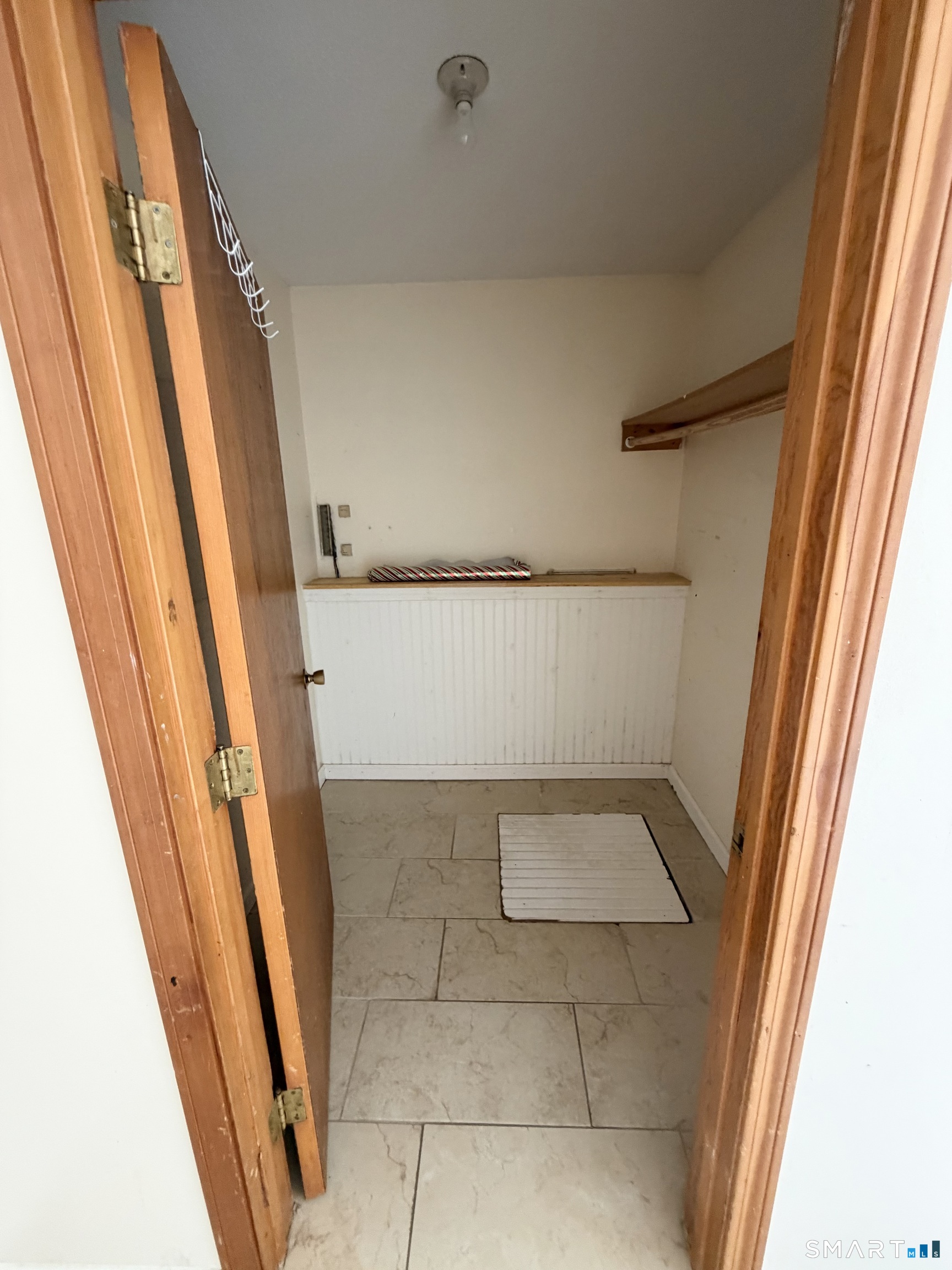 33 River Street Windsor, CT 06095 - Photo 7 of 11 a view of walk in closet with wooden floor
