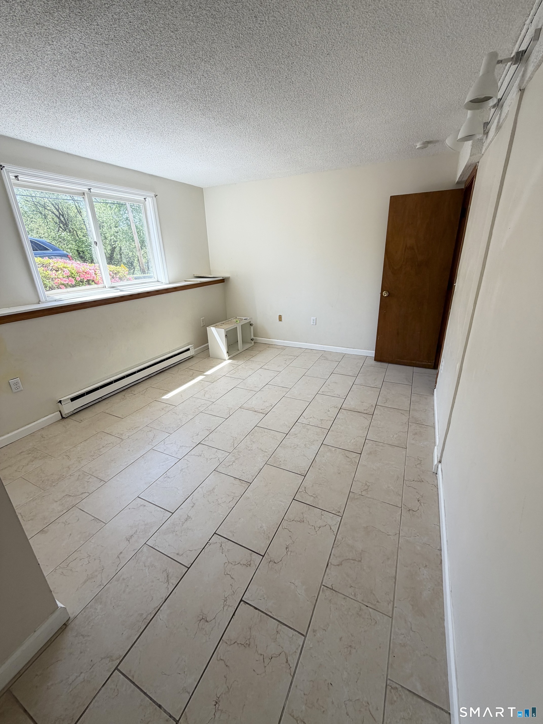 33 River Street Windsor, CT 06095 - Photo 9 of 11 a view of an empty room with a window