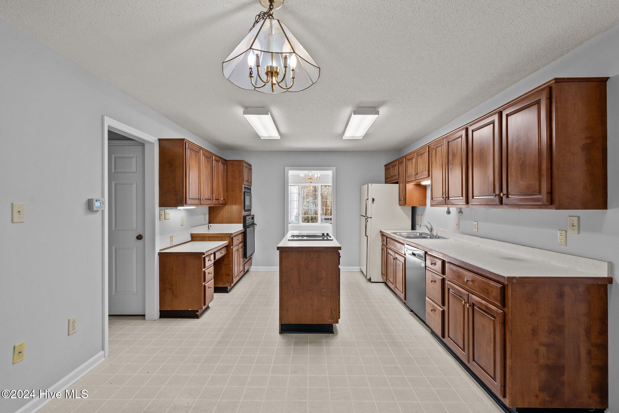 560 South Bethesda Road Southern Pines, NC 28387 - Photo 17 of 53 Kitchen view from the carolina room.