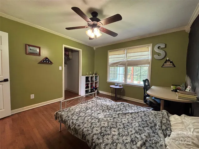 a bedroom with furniture and a window