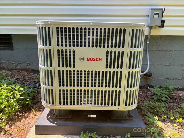 a view of a brick house with a bench