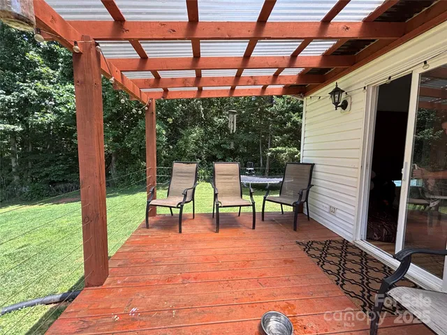 a view of sitting area with chairs in patio